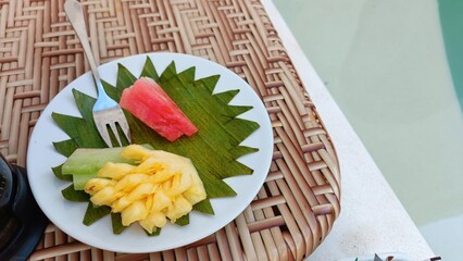 Tropical Fruit Plate on Elegant Woven Tray by Pool