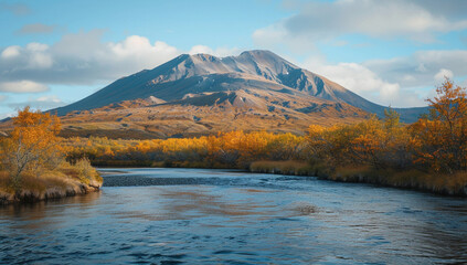 Wall Mural - a dome mountain with autumn colors painting its slopes and a calm river