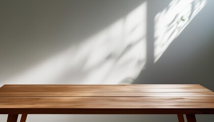 Wall Mural - Wooden Table Against a White Wall with Light Coming Through a Window