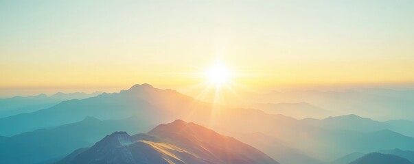 Serene sunrise over misty mountains, warm light spreading across the horizon creating a tranquil and picturesque landscape.