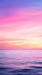 soft pastel sunset over the calm ocean, with gentle hues of pink, purple, and blue blending in the s