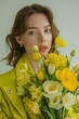 © BrandwayArt - Young woman in vibrant spring attire holding a bouquet of yellow flowers