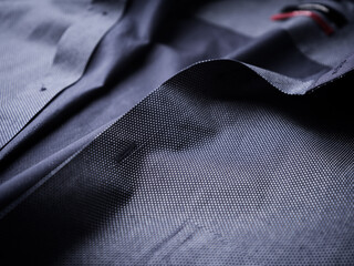 Close up of dark Men's shirt. Soft focus. Copy space.