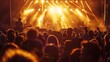 © Ivan - A crowd enjoying a concert in a park or beach as the sun sets, with stage lights shining and a band playing energetically on stage