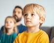 © Natalia - Family spending a quiet Labor Day at home, with parents and children resting on the couch and watching a favorite movie