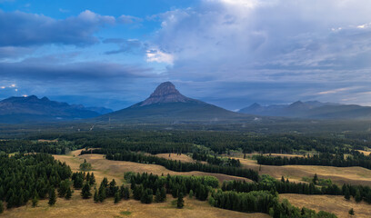 Wall Mural - Canadian rocky Mountains nature background. Cloudy Summer sunrise