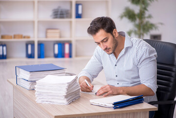 Poster - Young male employee working in the office