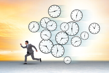 Wall Mural - Time stress management concept with businessman