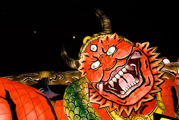 Poster - The Aomori Prefecture Nebuta festival. Located in Northern Japan, every summer Aomori hosts the Nebuta festival. This is a festival celebrating gods and stories with giant paper lanterns.