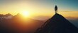 © narak0rn - Silhouette of a man standing on a mountain peak at sunrise.