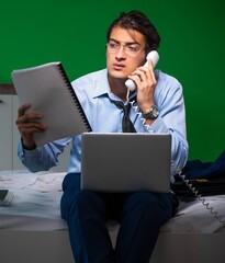 Poster - Young businessman under stress in the bedroom at night