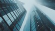 © bosse - Skyward View of Modern Skyscrapers in a Misty City