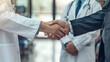 © Melvin - The businessman shaking hands with the doctor in a hospital