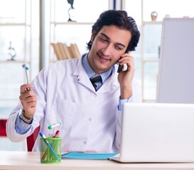 Sticker - Young handsome doctor in front of whiteboard