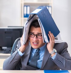 Wall Mural - Overloaded with work employee under paperwork burden