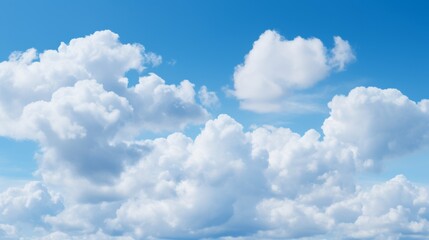 Poster - Puffy cumulus clouds in a bright blue sky with plenty of room for copy