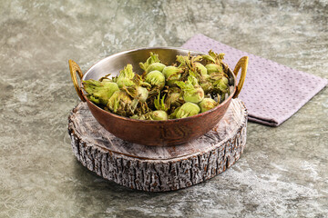 Canvas Print - Fresh green ripe hazelnut heap