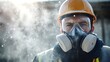 © pentolo - Construction worker wearing a respirator and safety goggles looks intently into the camera while standing in a cloud of dust.