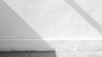 Poster - A white wall with a diagonal shadow cast on it. The wall has a white trim at the base, below which is a gray floor.