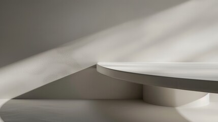 Poster - A white circular shelf juts out from a wall, with a beam of sunlight casting a shadow on the surface. The light and shadow create a dramatic contrast and highlight the texture of the wall.
