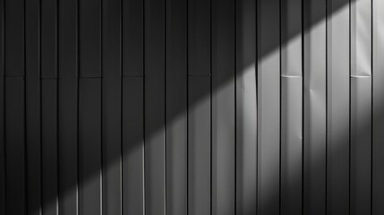 Leinwandbilder - Sunlight shines onto a wall of vertical panels, casting a long, diagonal shadow across the surface. The light highlights the texture of the panels and creates a stark contrast between the light and da