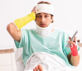 Wall Mural - Young injured man staying in the hospital