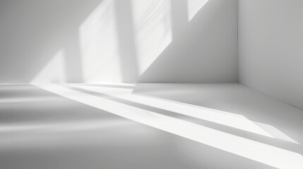 Poster - Sunlight streams through a window and casts long, rectangular shadows across the white floor of an empty room. The walls are also white, creating a minimalist and clean aesthetic.