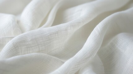 Poster - A close-up image of a white linen fabric draped smoothly, showcasing its delicate texture and soft folds. The fabric is lit with a soft, natural light that emphasizes its subtle sheen and highlights t