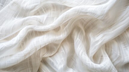Poster - The image shows a close-up of white fabric with a delicate embroidered pattern. The fabric is soft and flowing, creating a sense of movement and texture. The embroidered design is subtle, adding a tou