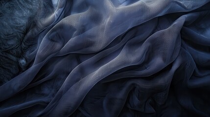 Poster - Soft, blue, sheer fabric is draped and folded, creating abstract waves and patterns. The texture of the fabric is evident, showcasing its delicate, almost translucent quality.