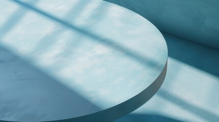 Poster - A round, blue surface sits atop a slightly darker blue background. The surface is smooth, and the light casts long, thin shadows across it. The image is simple, abstract, and minimal.