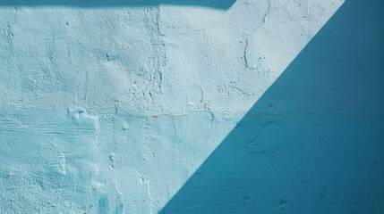 Poster - A textured light blue concrete wall, with a single diagonal shadow cast from an object above. The shadow is a darker shade of blue, contrasting with the lighter color of the wall.