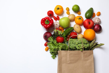 Poster - Delivery of vegetarian products. Bag with different vegetables and fruits on white background, top view