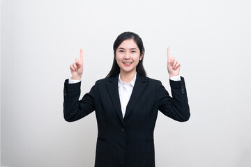 Wall Mural - Confident Asian business woman smiling and looking at the camera looks professional and executive. successful confident smart independent businesswoman ceo bank manager isolated on white background