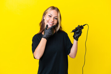 Tattoo artist Russian woman isolated on yellow background happy and smiling