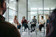 © Jacob Lund - Group discussion with diverse professionals sharing expertise in a modern office setting