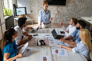 Sticker - Diverse business people in office during brainstorming while discussing ideas for their new project.