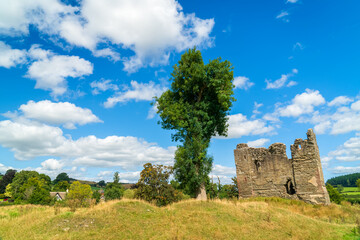 The grounds of the ruins Hopton Castle a Medieval castle in landscape orientation on a summer day