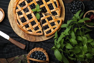 Wall Mural - Tasty homemade pie with blueberries, fresh berries, mint and knife on wooden table, flat lay