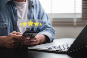 Customer review good rating feedback concept, A person using a smartphone to leave a 5-star review, with emphasizing online feedback. testimonial and testimony, user comment and feedback for review.