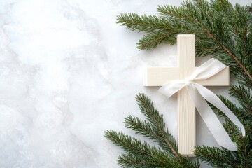 Wall Mural - White christianity wooden cross with white silk ribbon and green fir branch on a light grey marble background with copy space. Christmas holidays. Christian religion background. Flat lay, ai