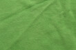 © tatomm - Clothing fabric green microfiber texture background, close up of cloth textile surface abstract.