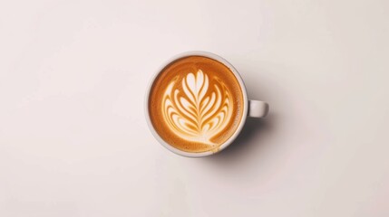 Cappuccino coffee with latte art sits on a white background