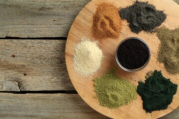 Sticker - Different superfood powders on wooden table, top view. Space for text