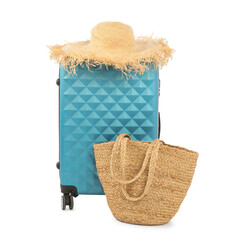 Canvas Print - Light blue suitcase, bag and straw hat isolated on white