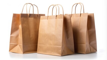 Brown paper bags with twisted paper handles on a white background, Mockup template for branding, packaging, and labeling, isolated and ready for customization.