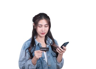 Poster - A woman is looking at her phone while holding a credit card