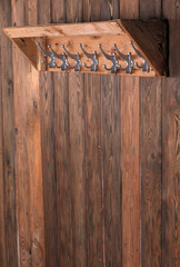 Wall Mural - wooden hanger with hooks on old wooden wall