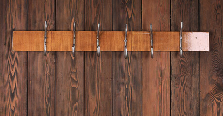 Sticker - wooden hanger with hooks on old wooden wall