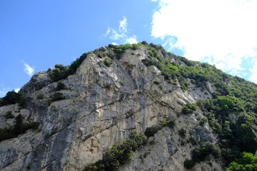 Wall Mural - Picturesque view of rocky cliff against blue sky